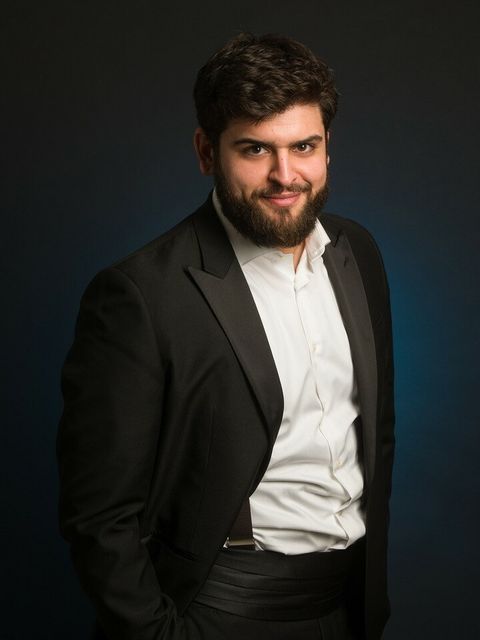 Adolfo Corrado in a dark suit