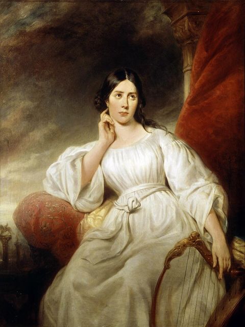 Maria Malibran in a white dress, seated